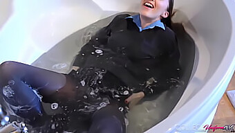 A Sexy Brunette In A College Dorm Takes A Bath And Gets Her New Uniform Wet.